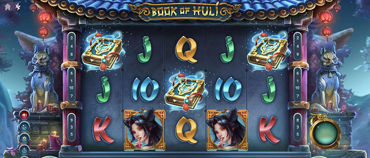 Игровой слот Book Of Huli на экране ноутбука в темном интерфейсе казино